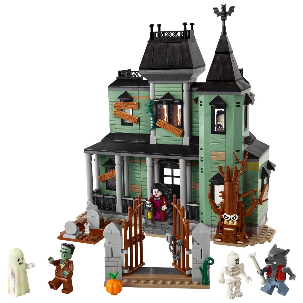 Toy haunted house set with characters on a white background