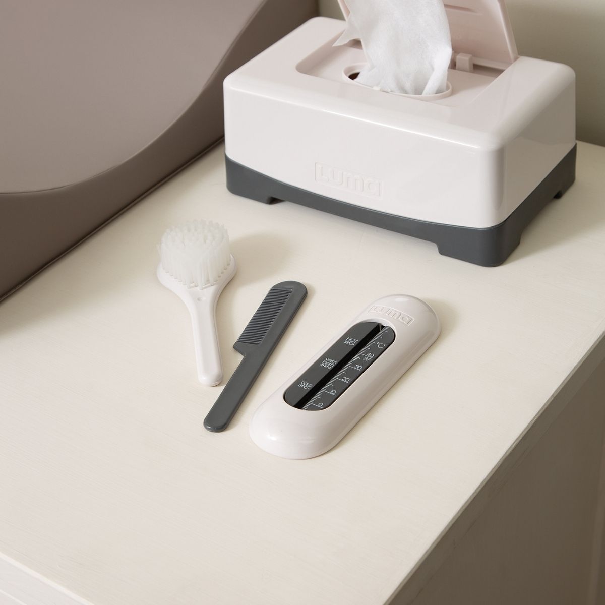 The Silk Oat coloured bath thermometer with other LUMA bath essentials.