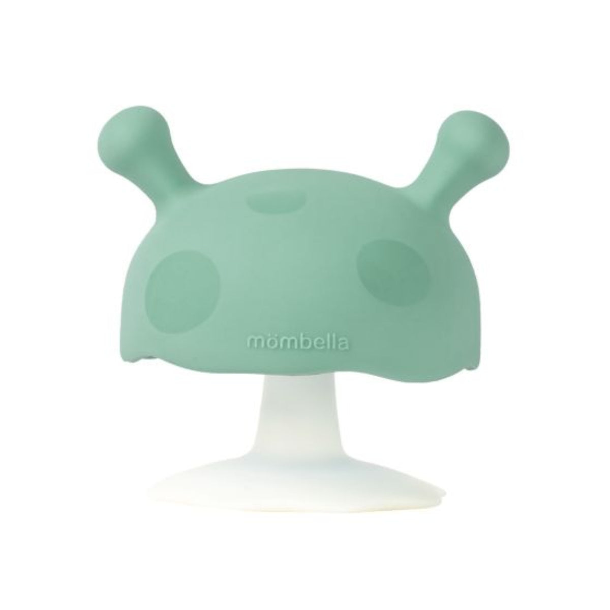 Green silicone teether with a white base on a white background, featuring the brand 'mombella'.