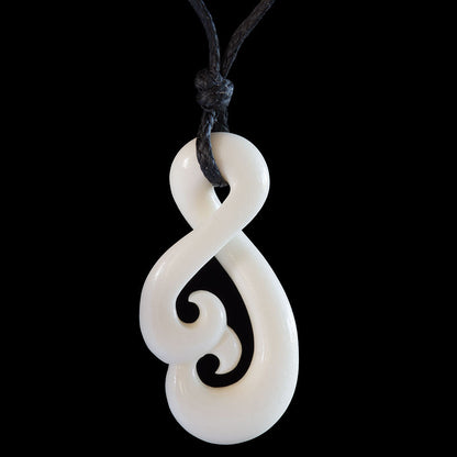Twist Koru, handcrafted bone pendant