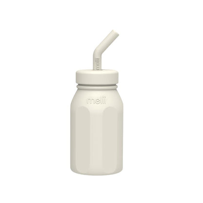 White bottle with straw lid on a white background