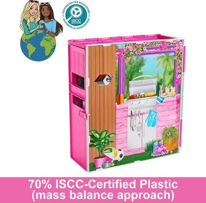 Pink playhouse with outdoor furniture and decor, featuring ISCC certification logo.