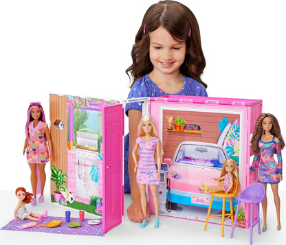 Young girl playing with a Barbie getaway toy set
