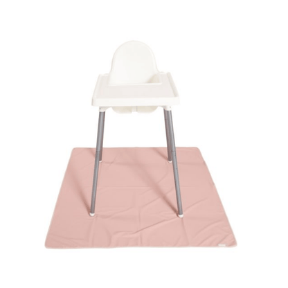 White high chair with a pink splat mat on a white background