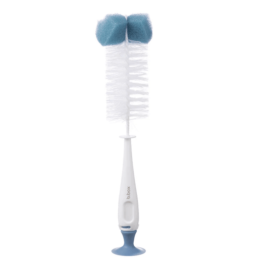 Babys bottle cleaning brush with blue bristles on a white background
