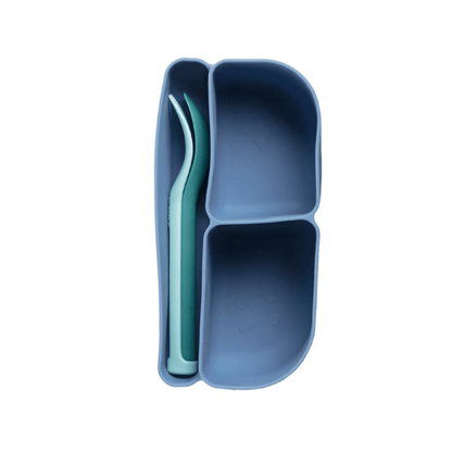 Blue divided snack container with a spoon on a white background