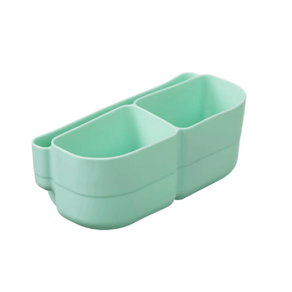 Light green silicone organizer with three compartments on a white background