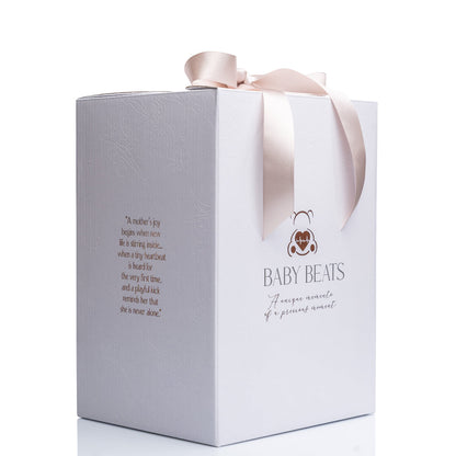 White gift box with pink ribbon and 'Baby Beats' branding on a white background