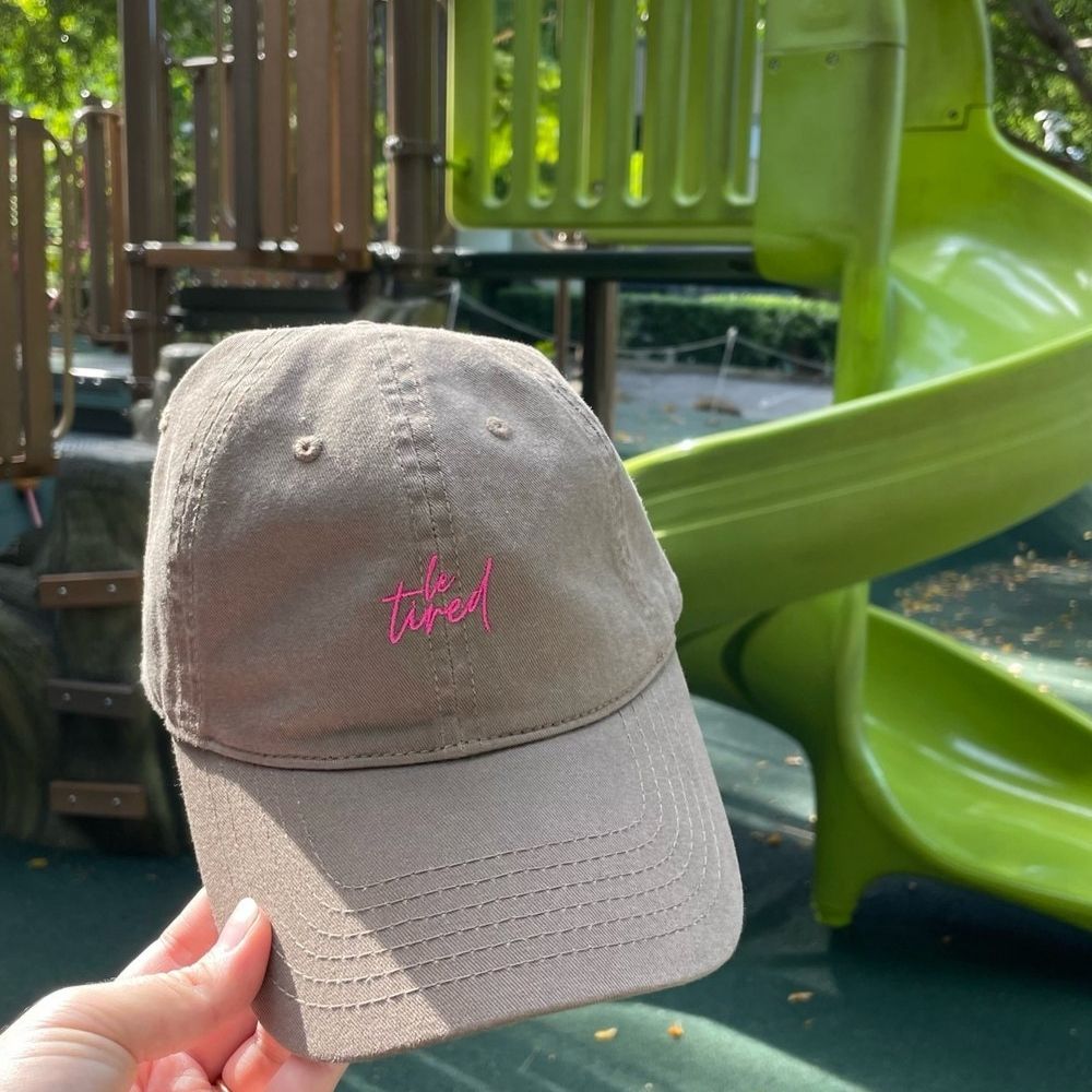 A brown Le Tired Hat.