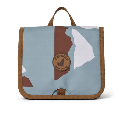 A hanging toiletry bag with a blue and brown design for kids to take away on holiday or to keep their bathroom organised.
