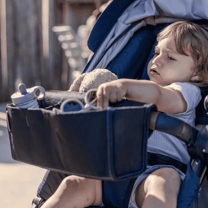 The Ezi Snack 2-in-1 Stroller Organizer is designed to simplify your outings with baby, keeping both snacks and small essentials close at hand.