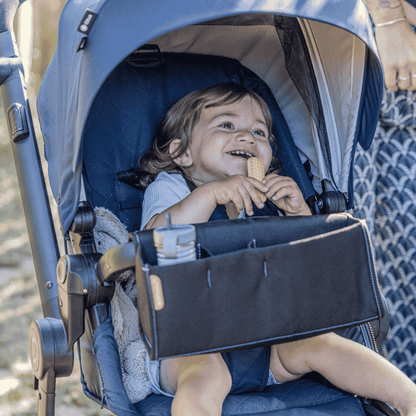 The Ezi Snack 2-in-1 Stroller Organizer is designed to simplify your outings with baby, keeping both snacks and small essentials close at hand.