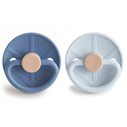 Two baby soothers, one blue and one light gray, with beige centers on a white background.