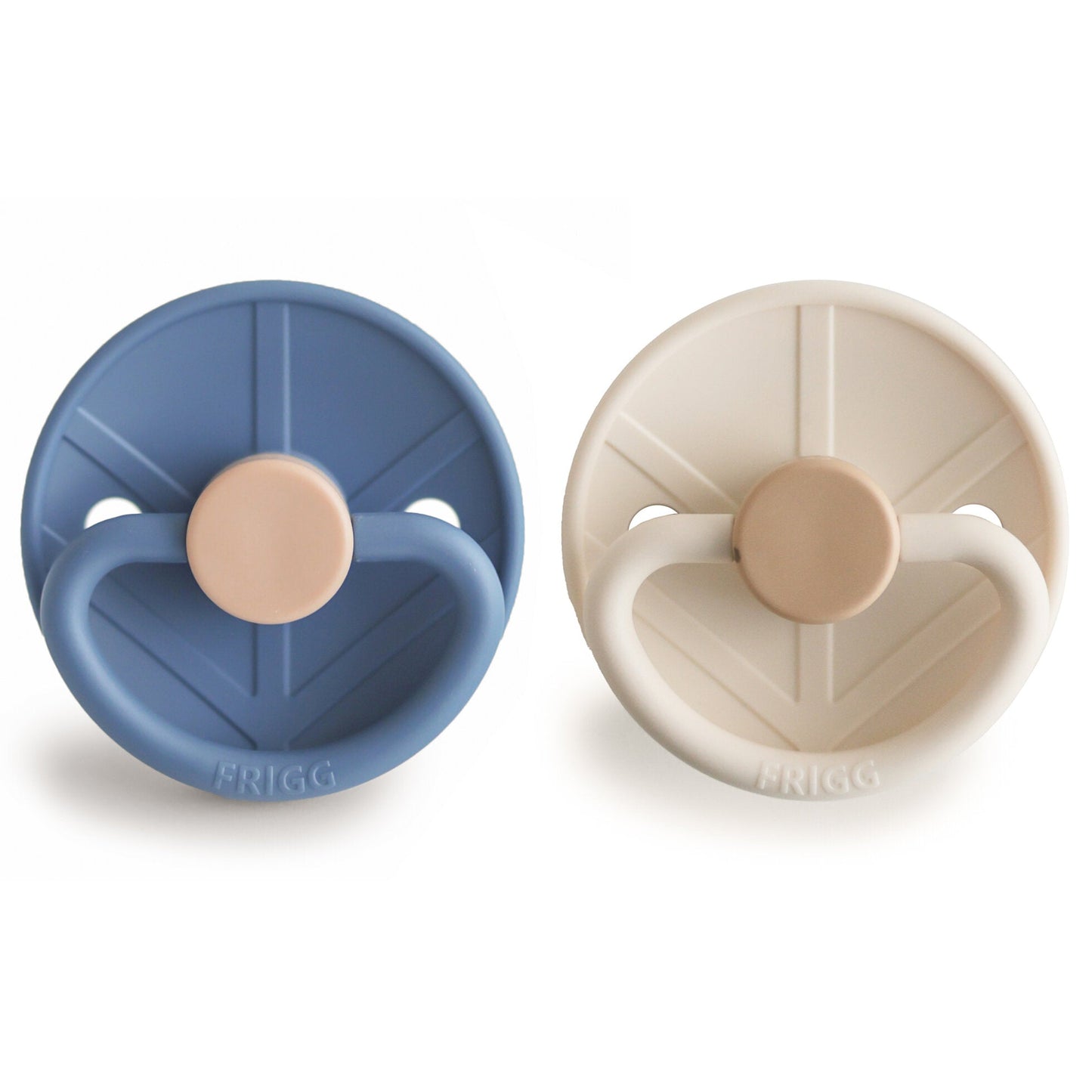 Two pacifiers, one blue and one beige, on a white background with 'FRIGG' branding.