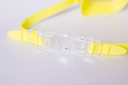Yellow goggles on a light gray background