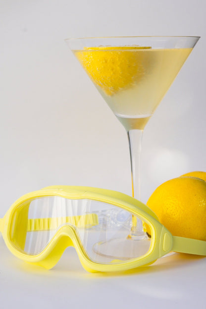 Yellow goggles on a light gray background