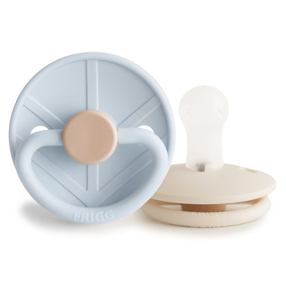 Two baby pacifiers, one blue and beige, the other white and beige, on a white background.