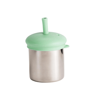 Metallic smoothie container with a green lid on a white background