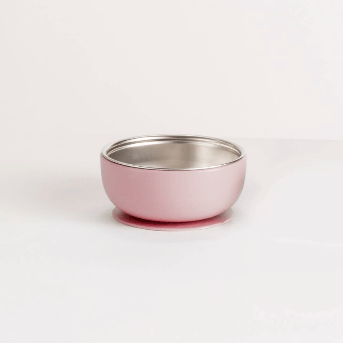 Pink and silver bowl on a white background