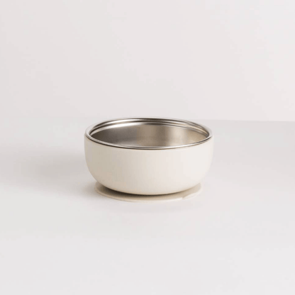 Small white bowl with a silver rim on a light gray background
