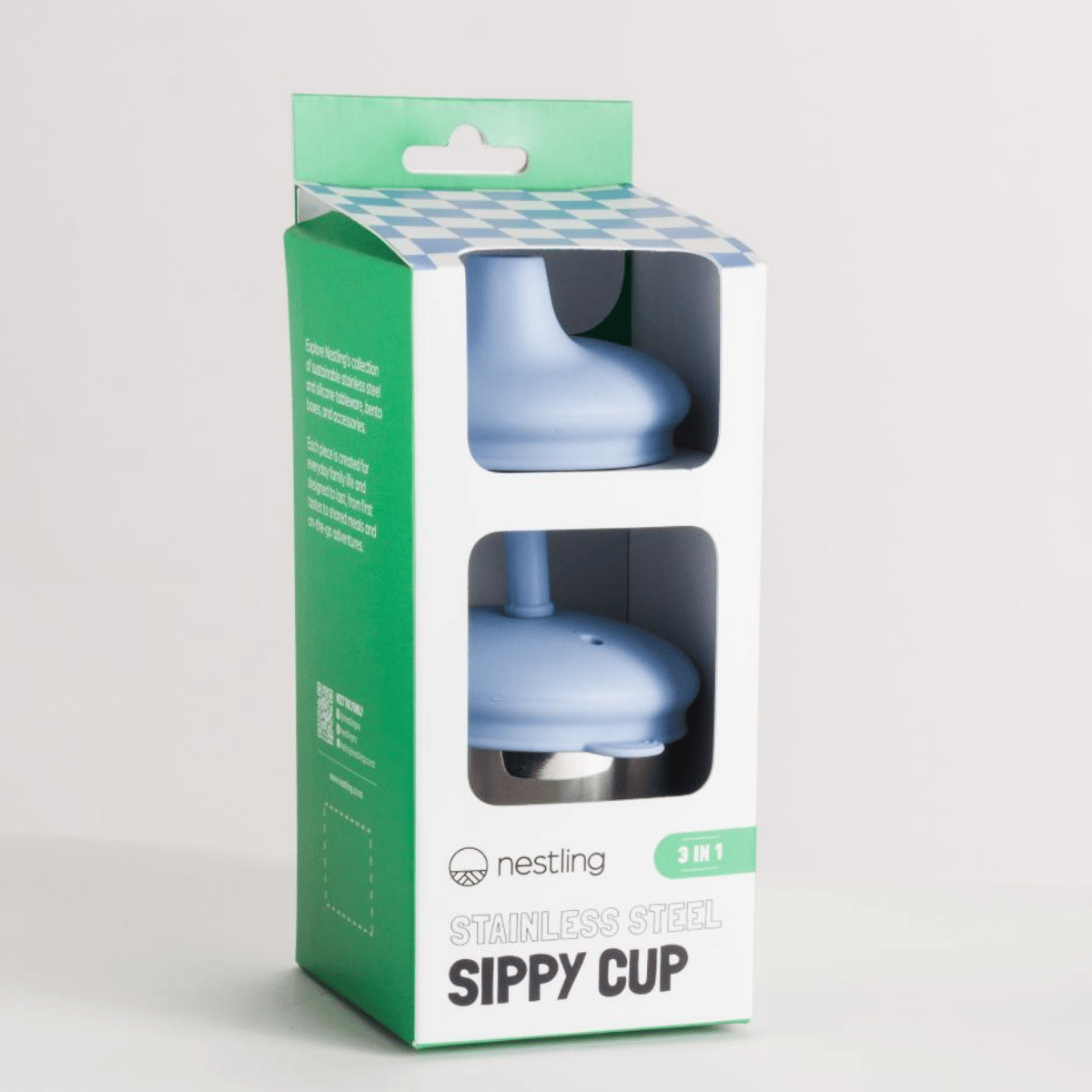 Blue sippy cup in a green and white packaging box on a light gray background