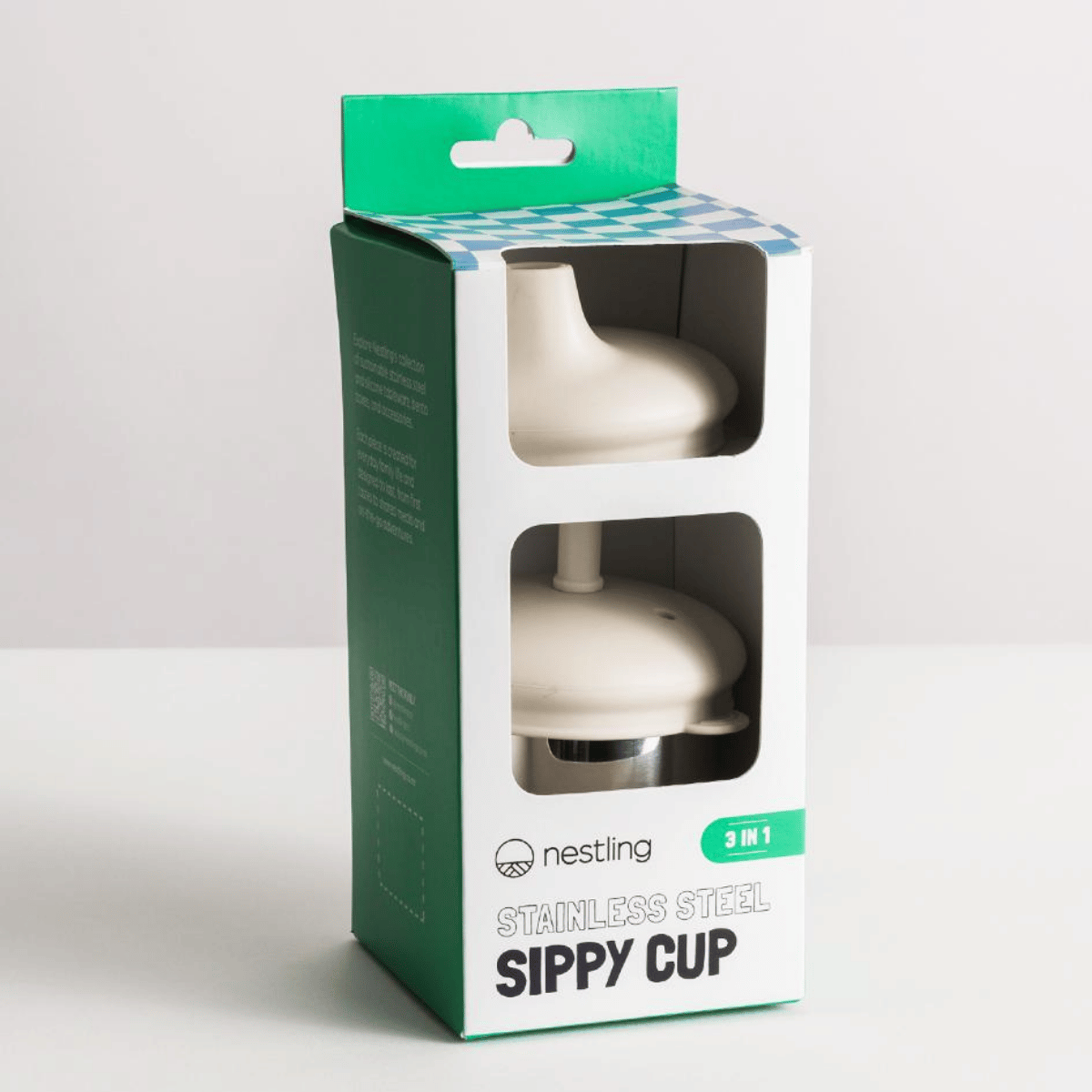 Nestling stainless steel sippy cup packaging on a white background