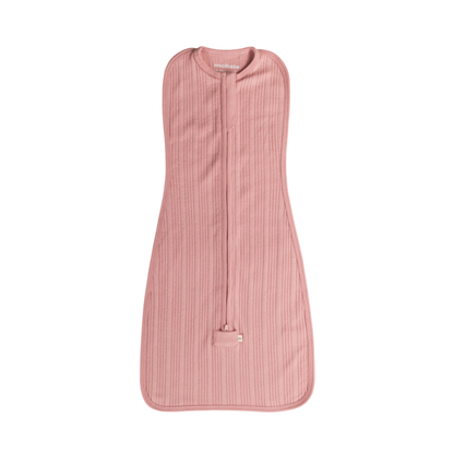 Pink baby sleeping bag with a zipper on a white background