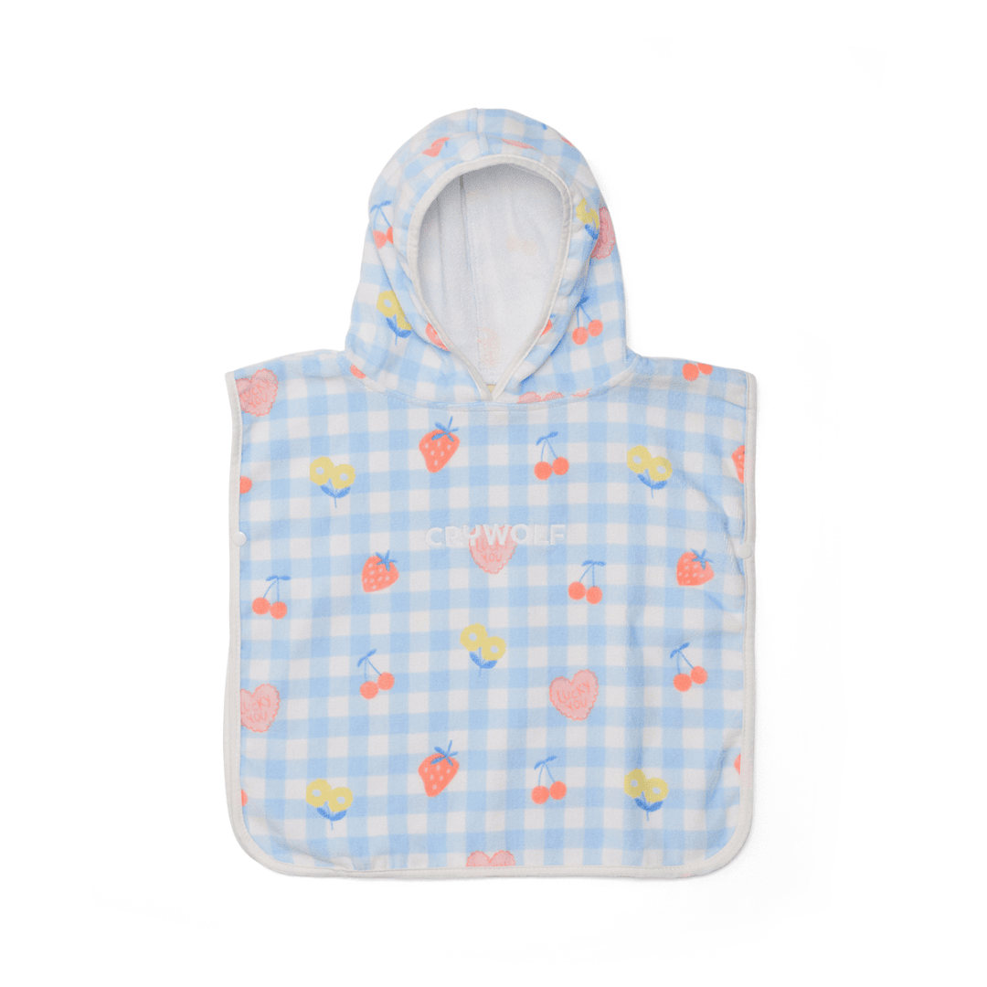 A baby hooded towel with colourful fruits on a plain white background.