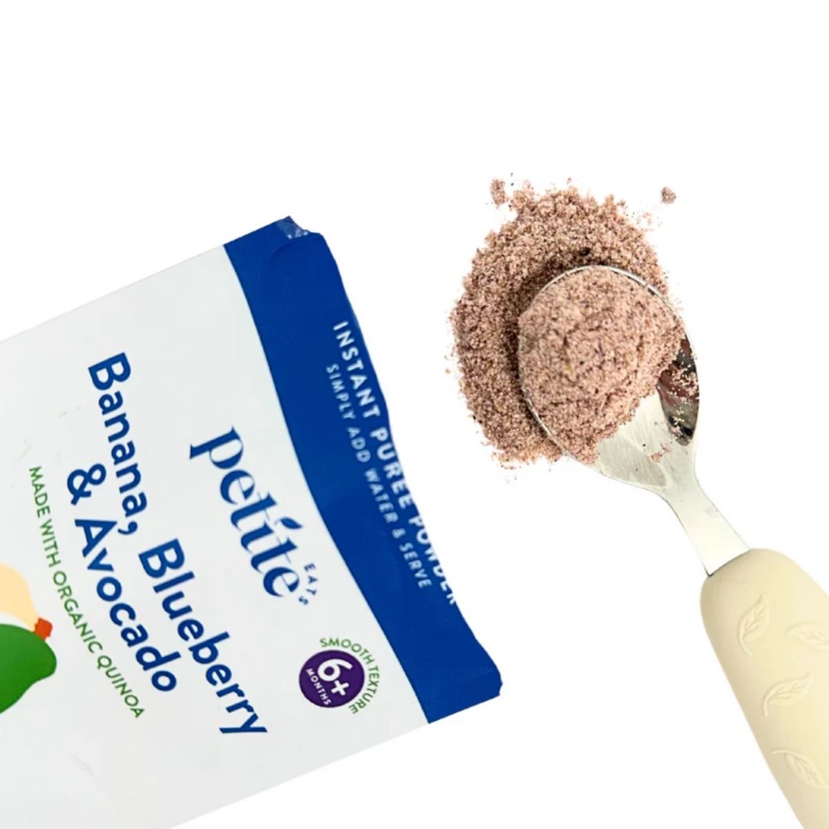 Showing the powdered puree coming out of the packet onto a baby spoon.