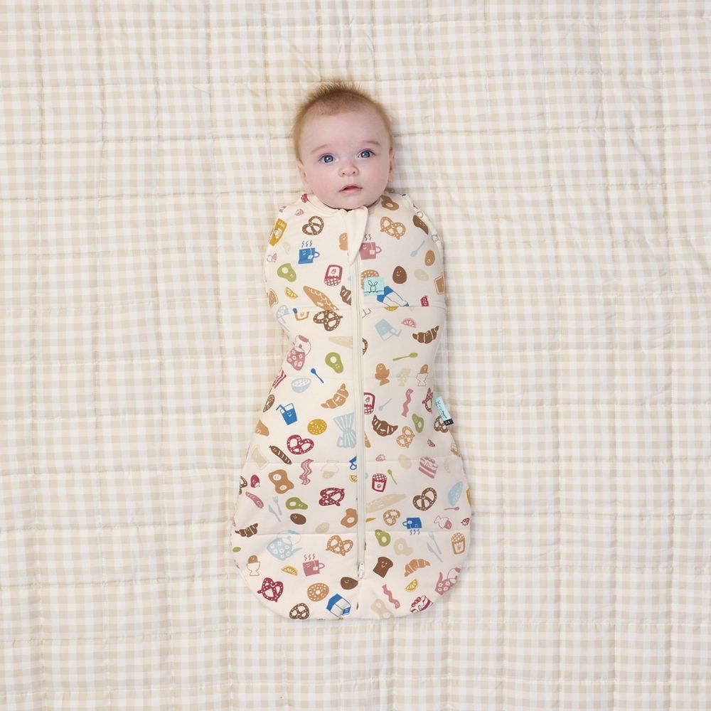 Baby swaddled in the 2.5 cocoon swaddle with his arms in.