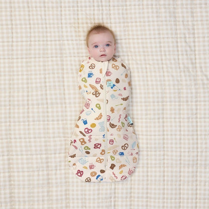 Baby swaddled in the 2.5 cocoon swaddle with his arms in.