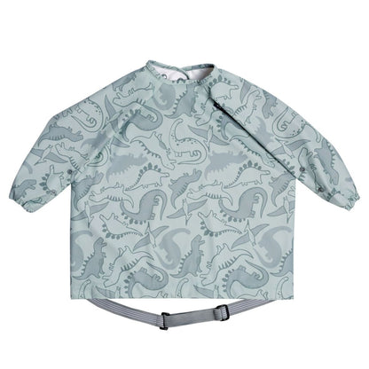 Babies bib with dinosaur pattern on a white background