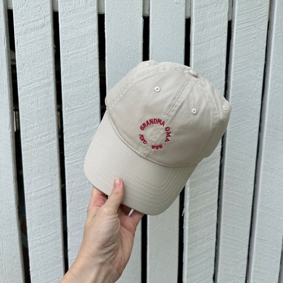 A cream hat for the grandmothers, Oma's.Nan's or Gigi's. A great gift for grandparents. red writing.