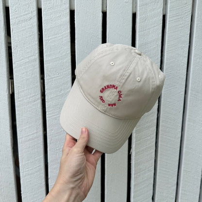 A cream hat for the grandmothers, Oma's.Nan's or Gigi's. A great gift for grandparents. red writing.