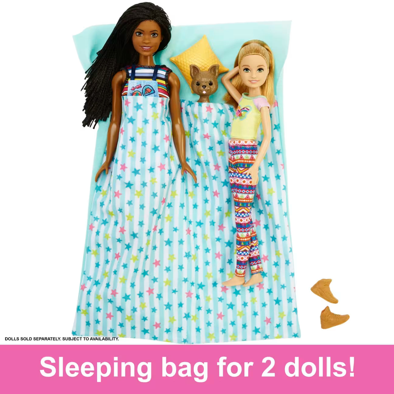 Two dolls and a dog lying on a star-patterned sleeping bag with text 'Sleeping bag for 2 dolls!'.