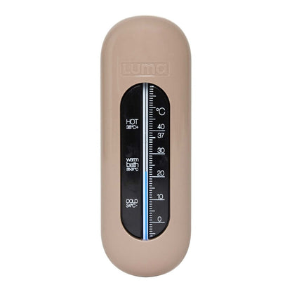 A beige bath thermometer for babies to ensure the water is at a safe temperature for them.