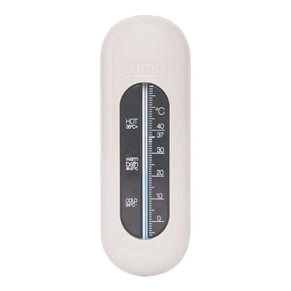 A cream coloured bath thermometer for babies to ensure the water is at a safe temperature for them.
