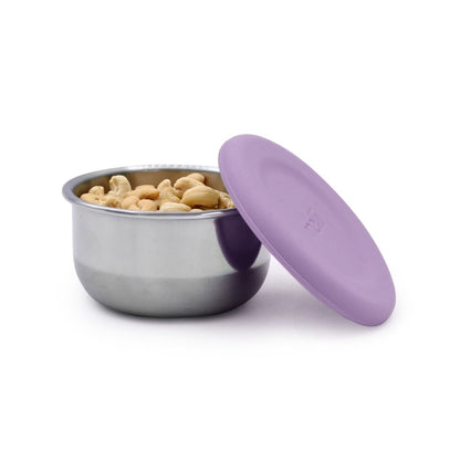 The purple container holding nuts as a snack option. 