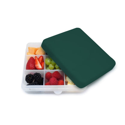 A dark green snack container  for kids snacks to eat whilst on the go or travelling.