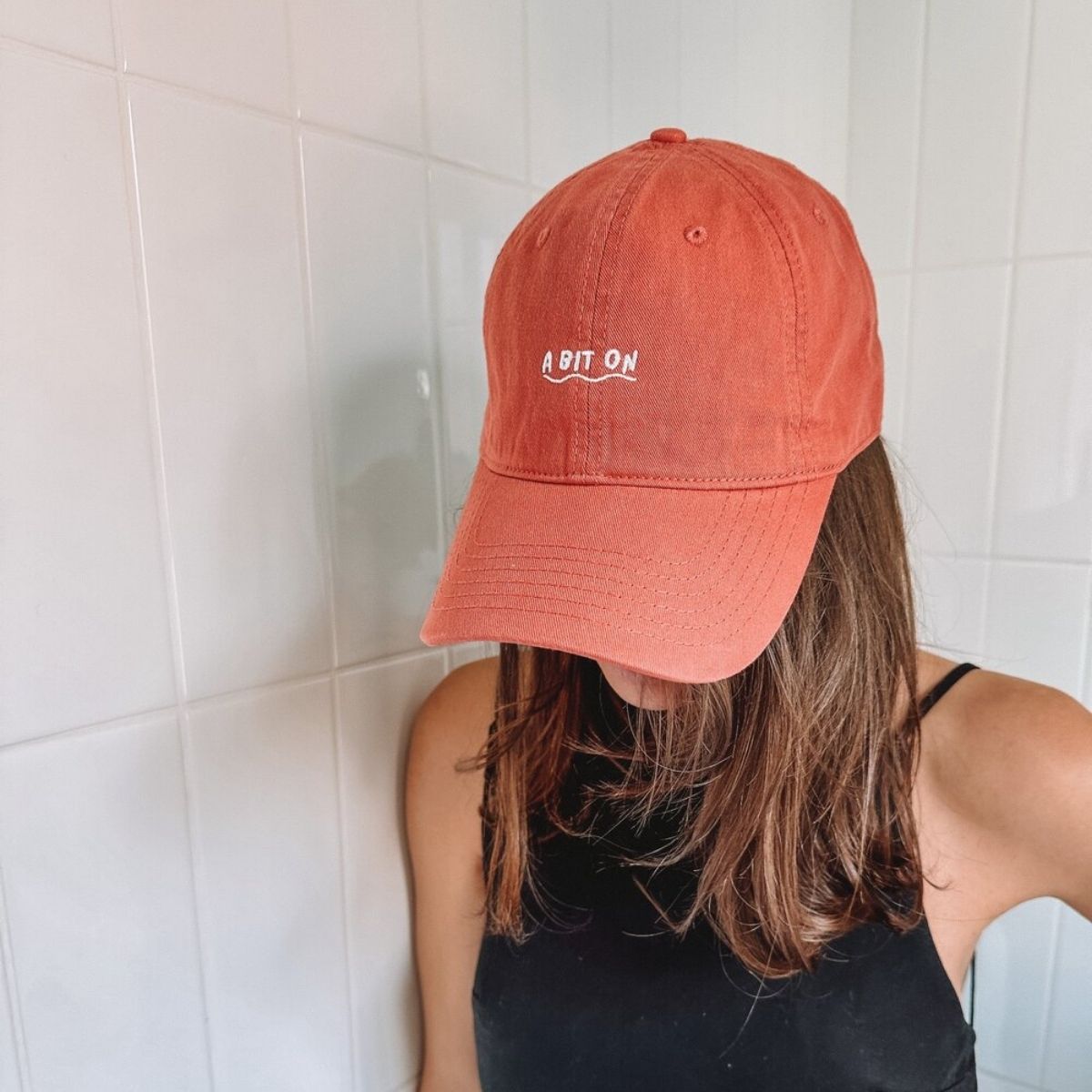 A Mum wearing the 'A Bit On Hat.