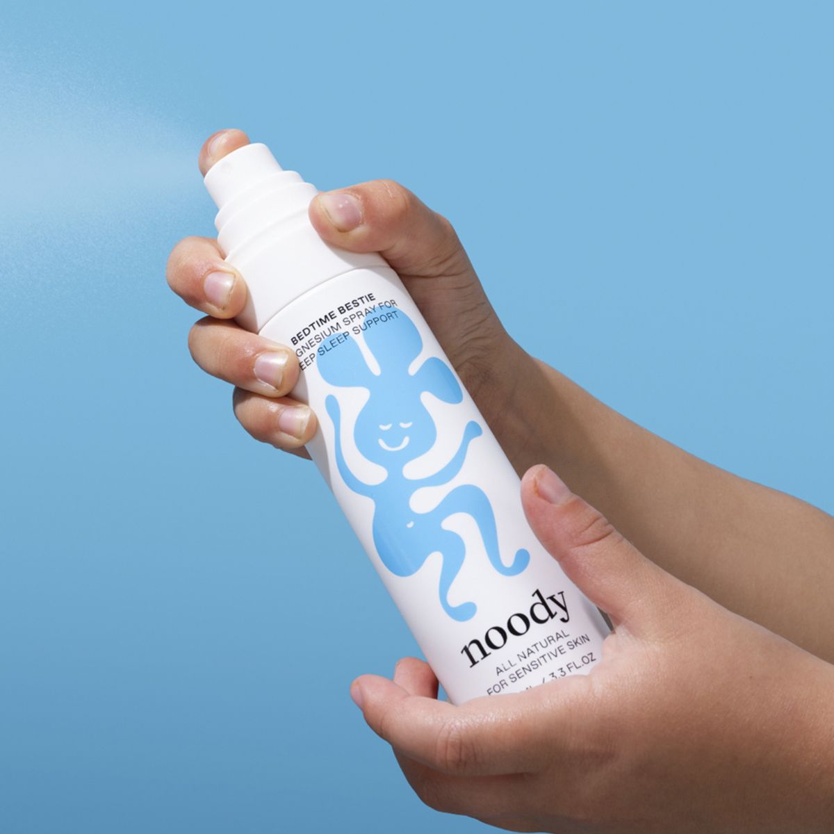 A child spraying the Noody Bedtime Bestie.