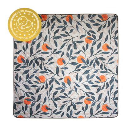 Floral patterned blanket with orange flowers and a baby innovation award badge on the top left corner.