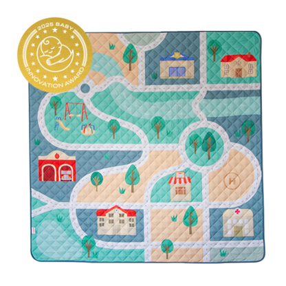 Children's play mat with road design and houses, featuring a 2025 Baby Innovation Award badge.